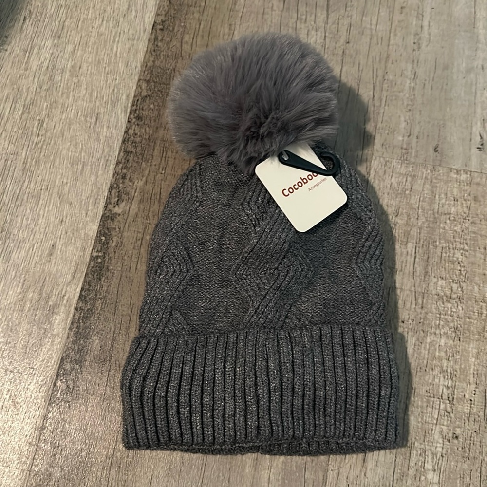 Gray toboggan with soft fluffy ball on top